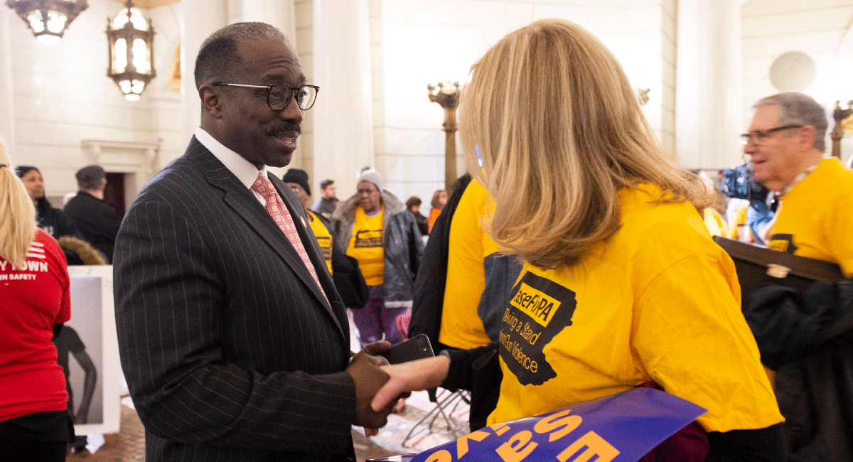 Representative Williams shaking hands with CeaseFire PA activist in Capitol rotunda